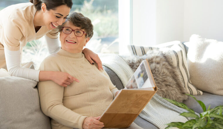 Grandmother with tender caregiver for memory care.
