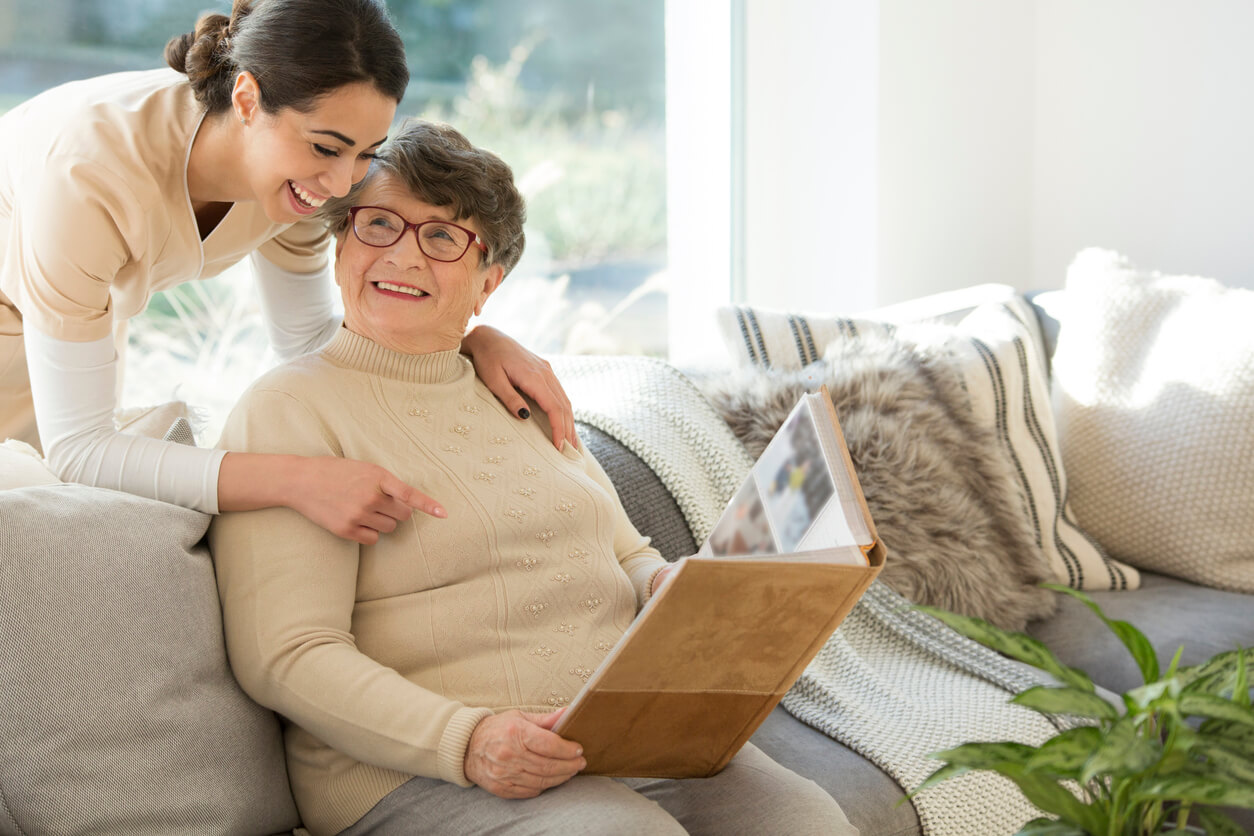 Grandmother with tender caregiver for memory care.